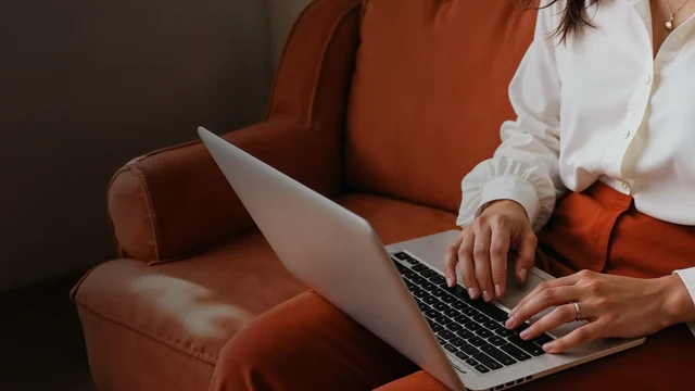 RedotPay customer using a laptop, from the official RedotPay media kit