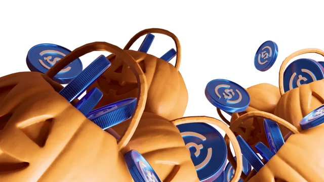 Orange jack-o’-lantern buckets overflowing with blue USDC coins