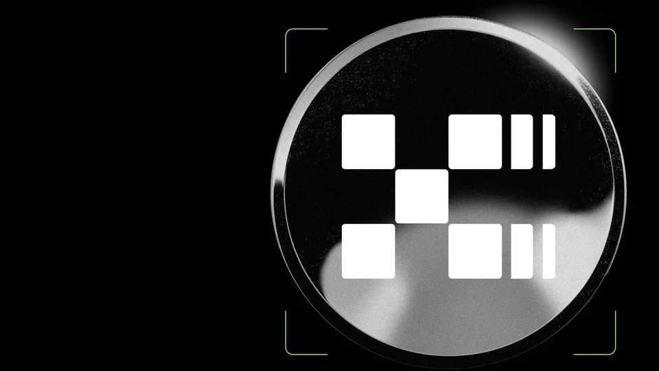 Silver-rimmed black coin with the white OKX mark inside green corner brackets on a black background
