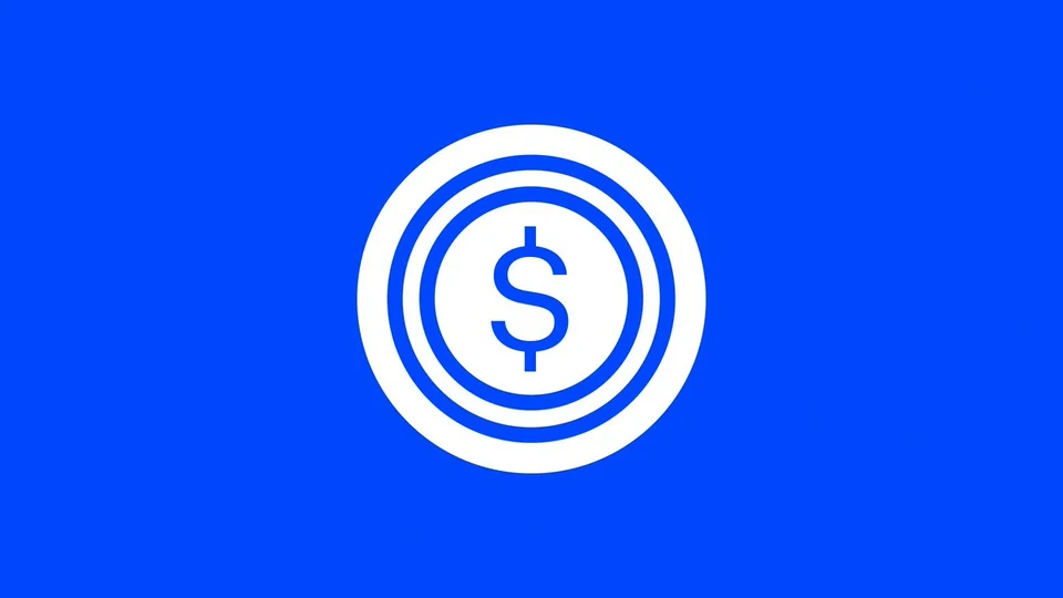White dollar coin icon with two rings on a bright blue background