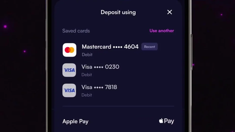 Moonshot deposit sheet from MoonPay's launch video, listing saved cards Mastercard ending 4604 marked Recent and two Visa cards above Apple Pay